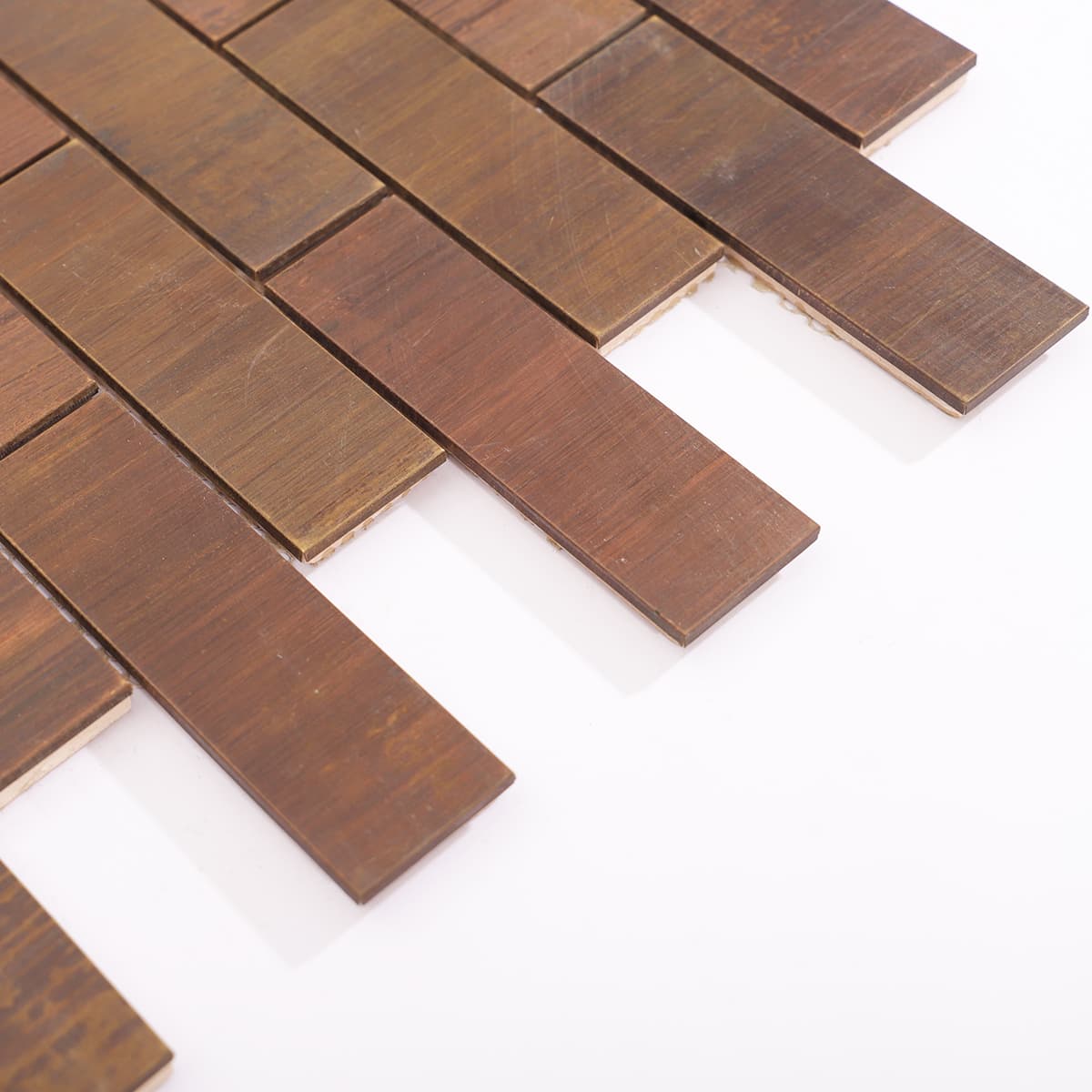 Edge detail of copper brick tile showing matte finish