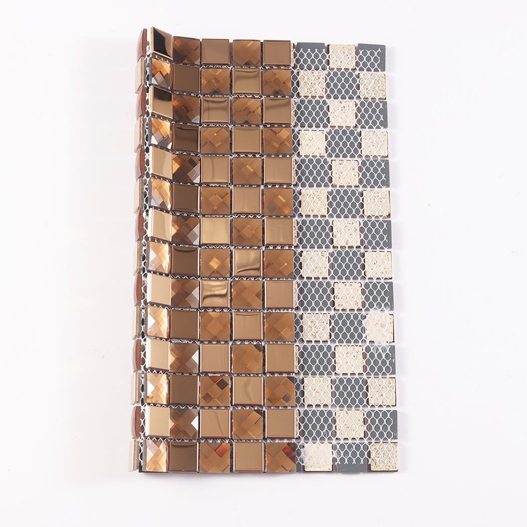 Copper glass mosaic tile folded to show the front design and the mesh backing.