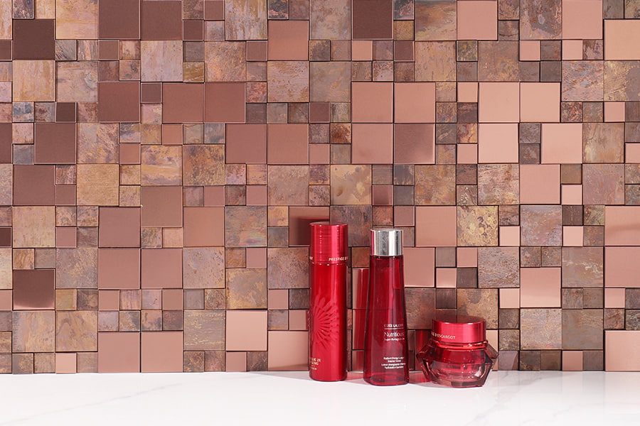 Copper metal mosaic tiles creating a modern backsplash design