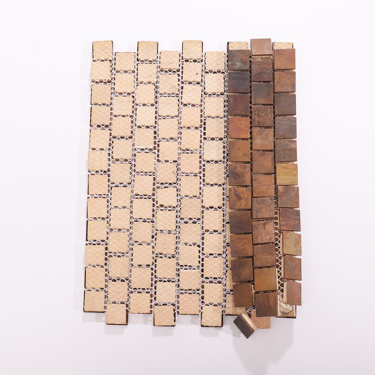 Back view of square copper tiles mounted on mesh sheet