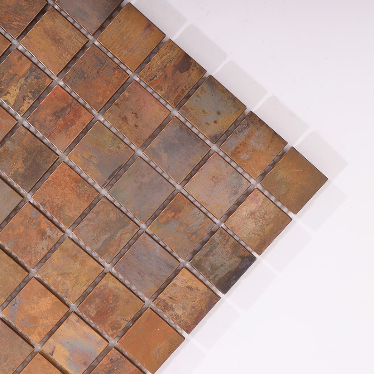 Corner close-up of flat copper mosaic with rich texture