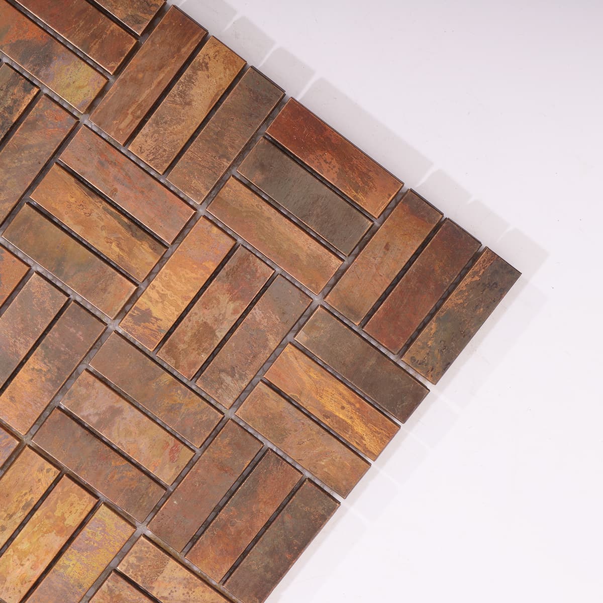 Corner detail of random copper mosaic tile