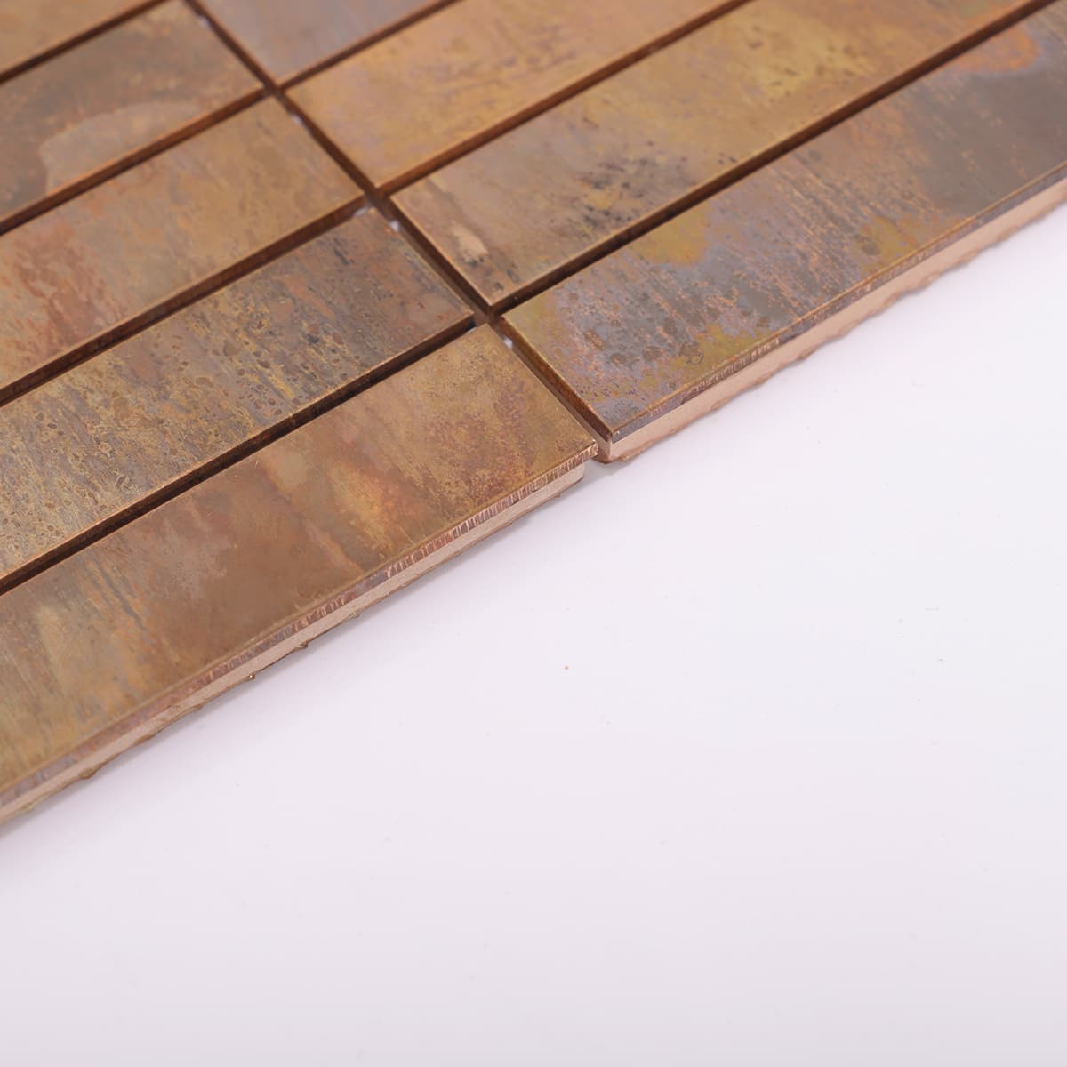 Side edge close-up of copper long strip mosaic tile