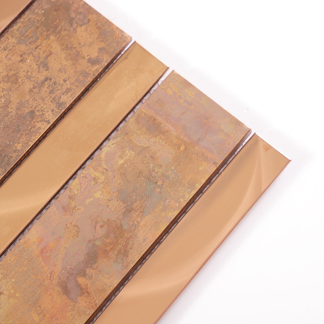 Close-up of copper and rose gold stainless steel tile texture and finish