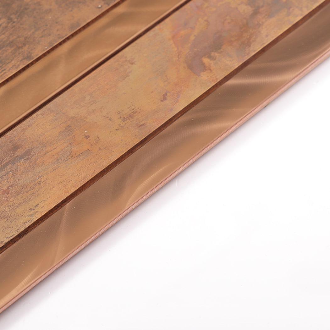 Edge angle view of copper and rose gold stainless steel linear mosaic wall tile