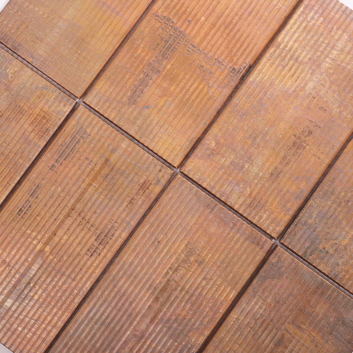 Angled view showing textured copper mosaic tile layout