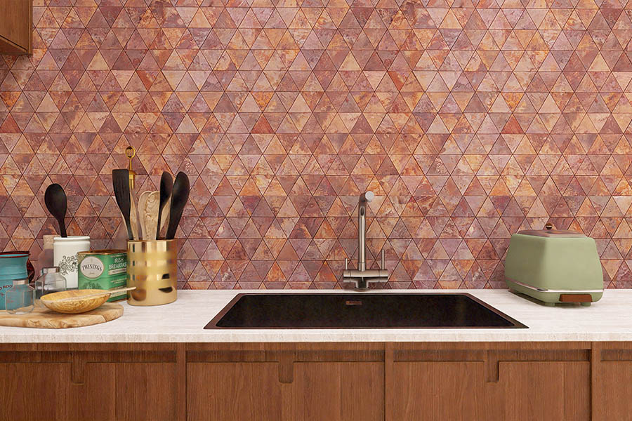 Wide view of copper triangle mosaic backsplash wall in modern kitchen setting