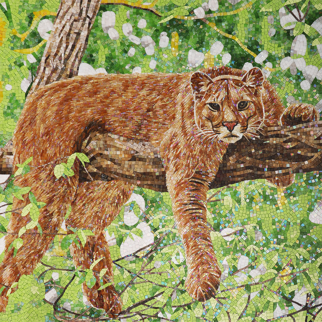 Full view of a cougar mosaic mural in green forest foliage