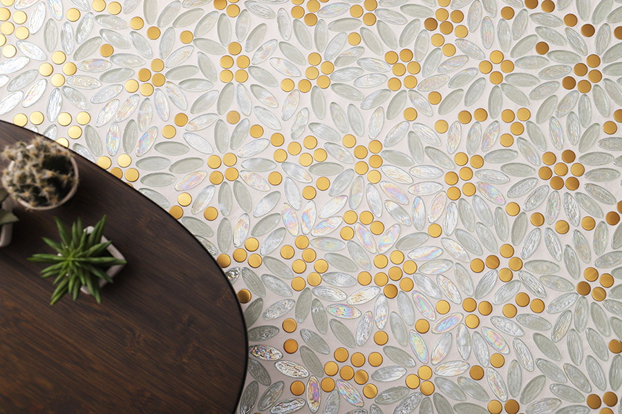 Daisy-inspired mosaic tile pattern with shell and glass pieces in random layout