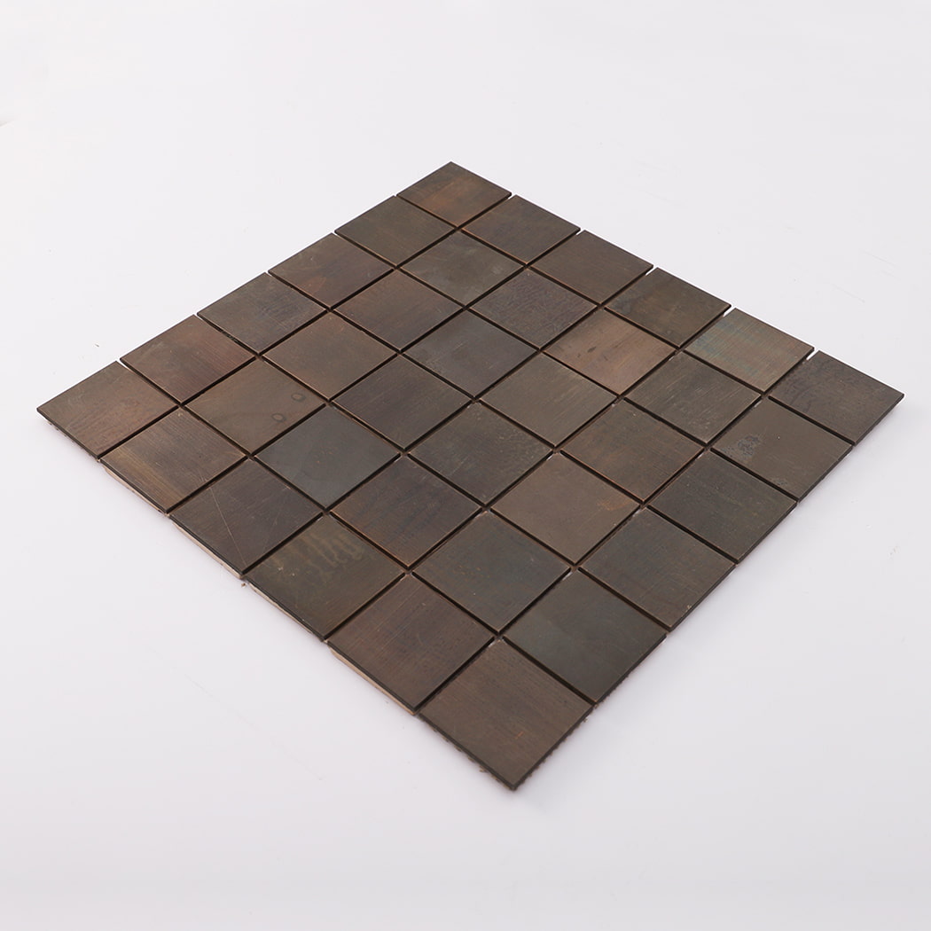 Angled view of dark brown copper square mosaic tile with vintage metallic luster.