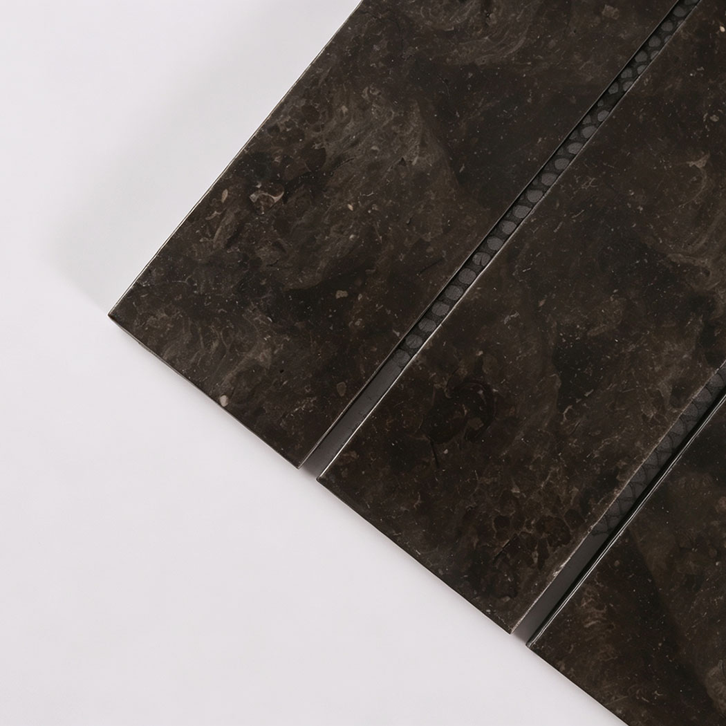 Close-up texture detail of dark brown marble mosaic tile sheet.