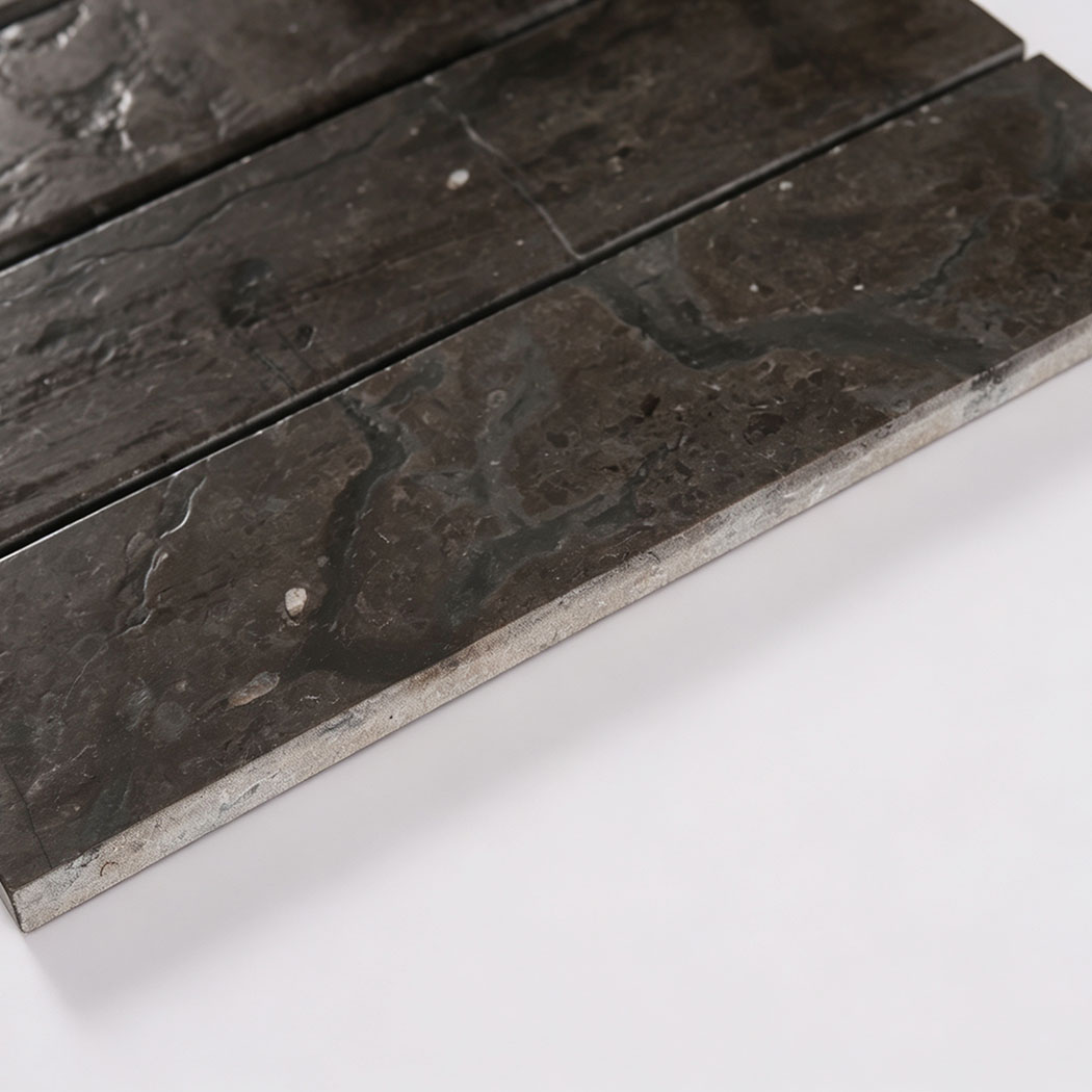 Edge view showing the thickness of dark brown marble mosaic tile.