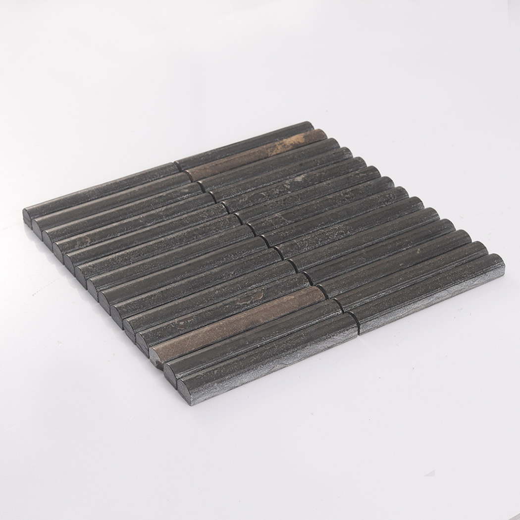Angled view of dark brown rounded marble fluted mosaic tile on white background
