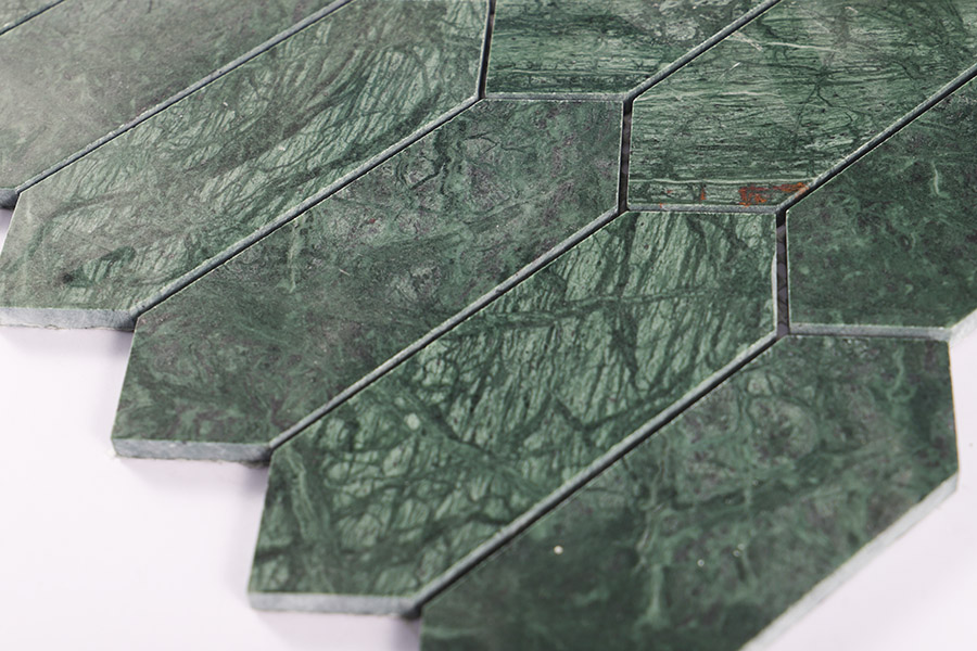Dark green marble picket tiles with natural veining in an elongated hexagon pattern.