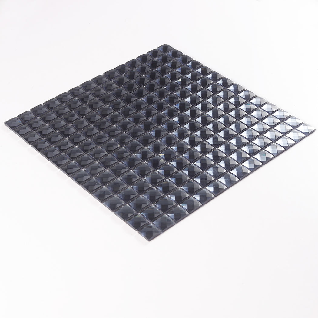 A full sheet of dark grey square glass mosaic tile viewed from a tilted angle.