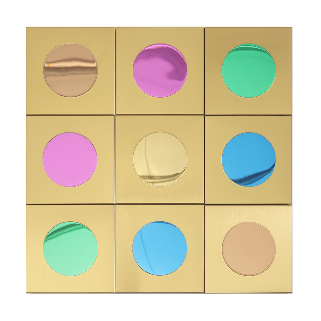 Front view of nine gold tiles featuring metallic pink, blue, green, and gold circular centers.