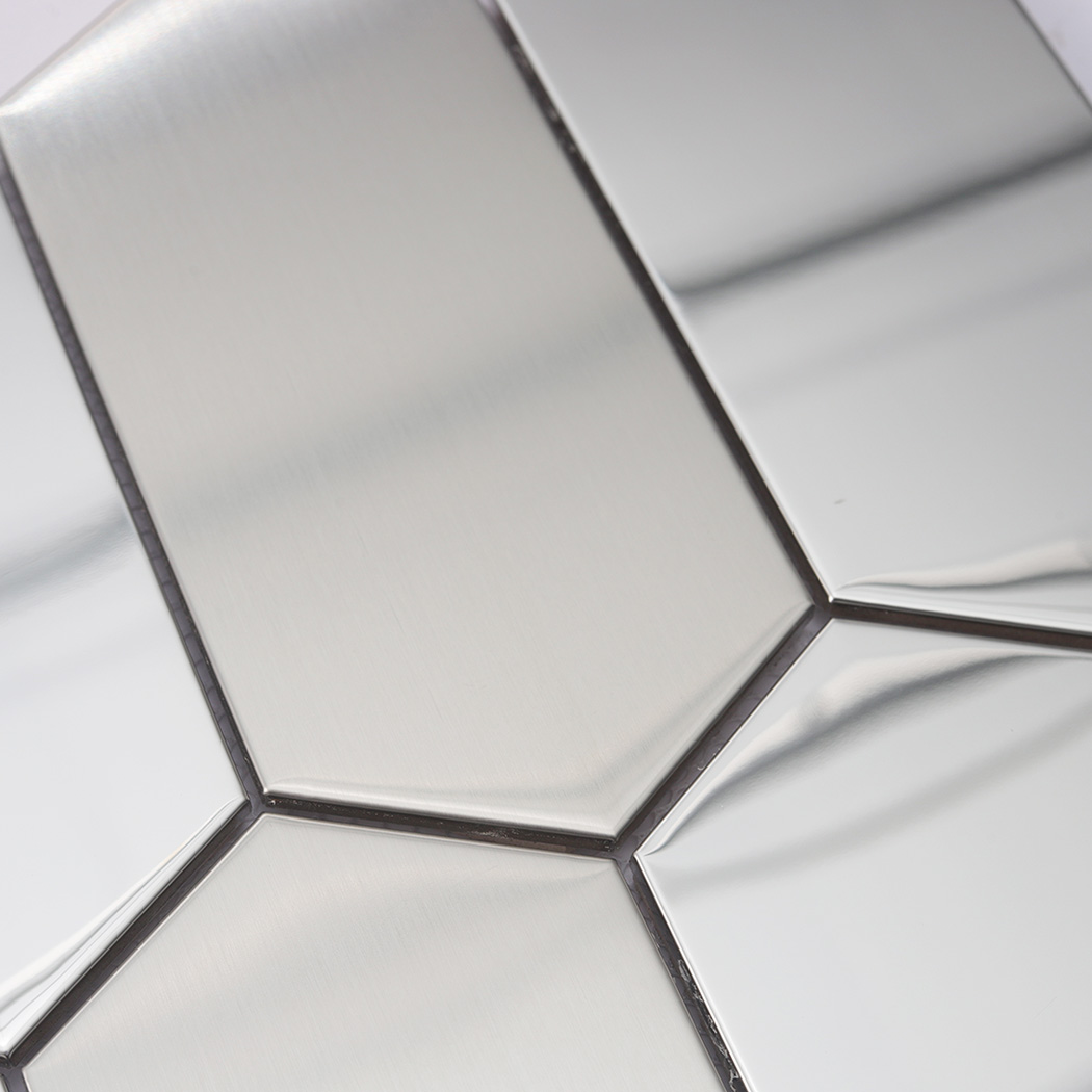 Close-up view of the brushed and polished silver surfaces on an elongated hexagon mosaic.