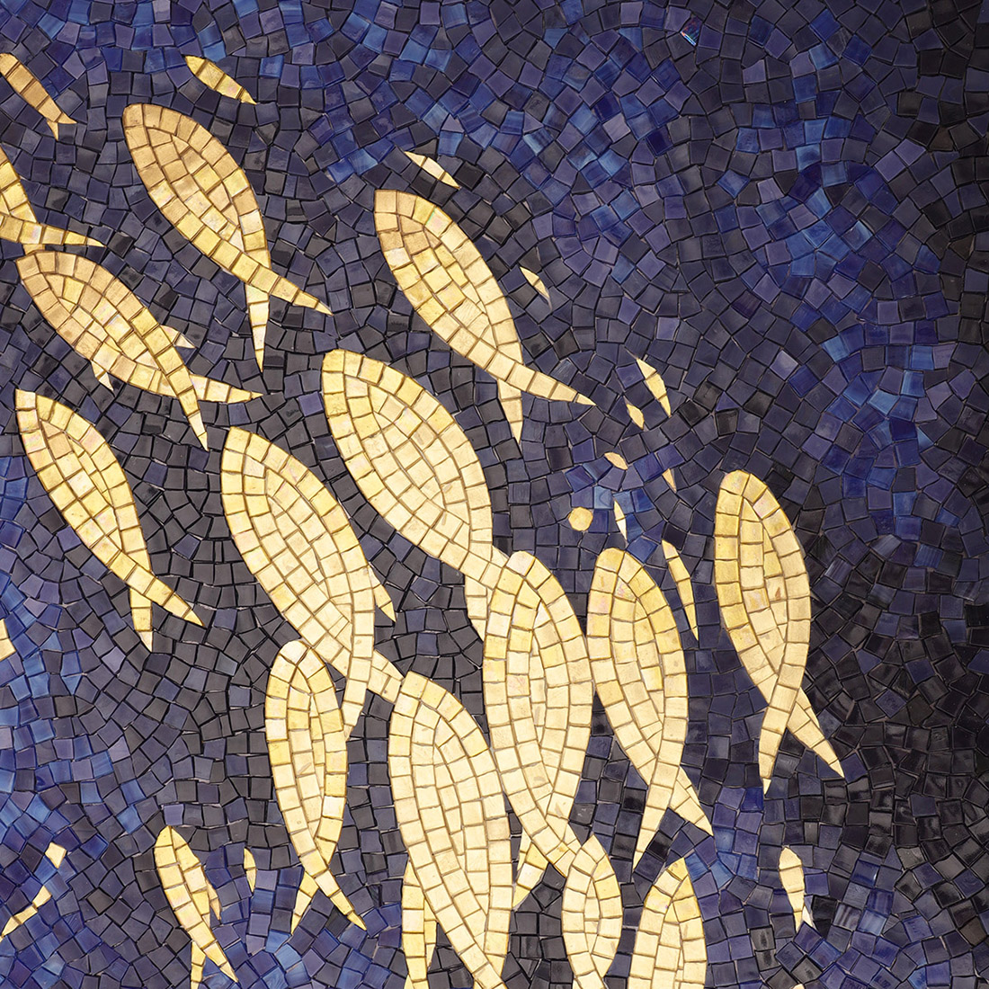 Deep blue glass mosaic mural with a flowing pattern of golden fish