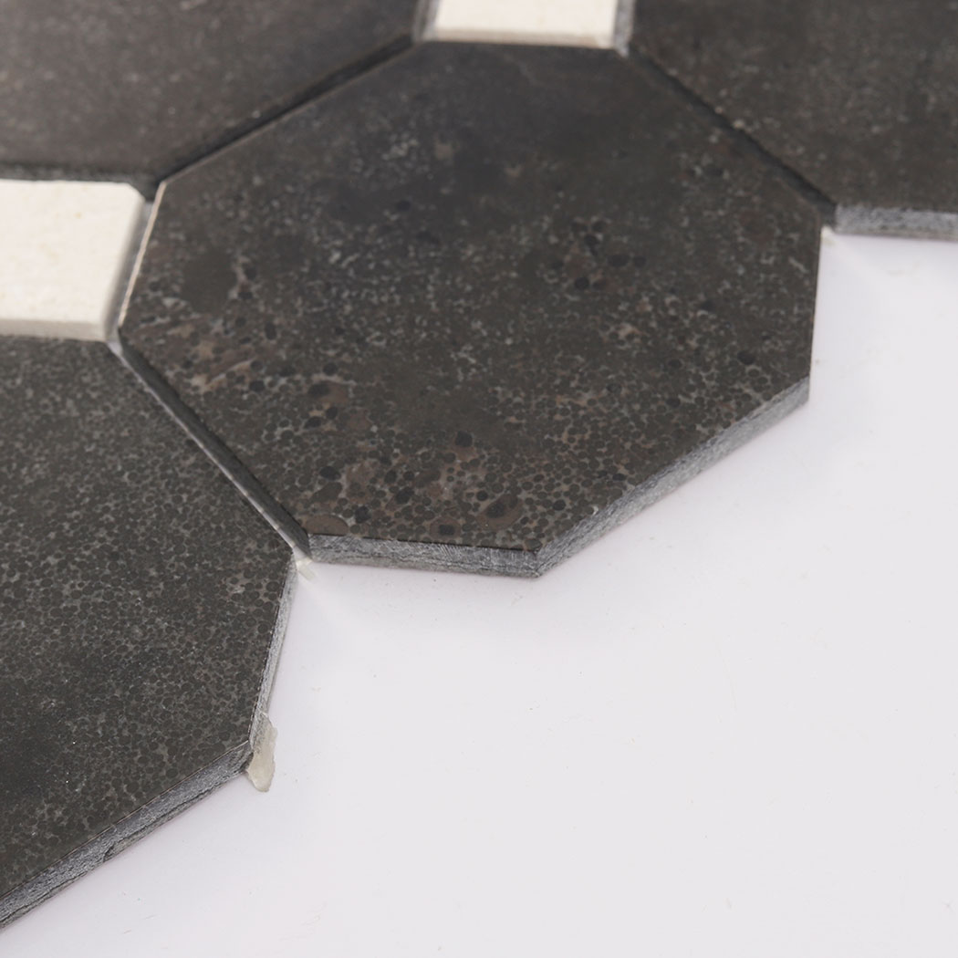 Edge profile of deep brown octagon mosaic tile showing thickness and cut corners
