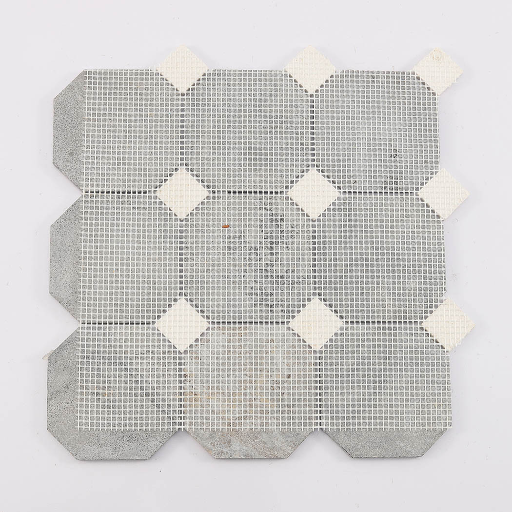 Back view of deep brown octagon mosaic tile showing mesh mounted backing