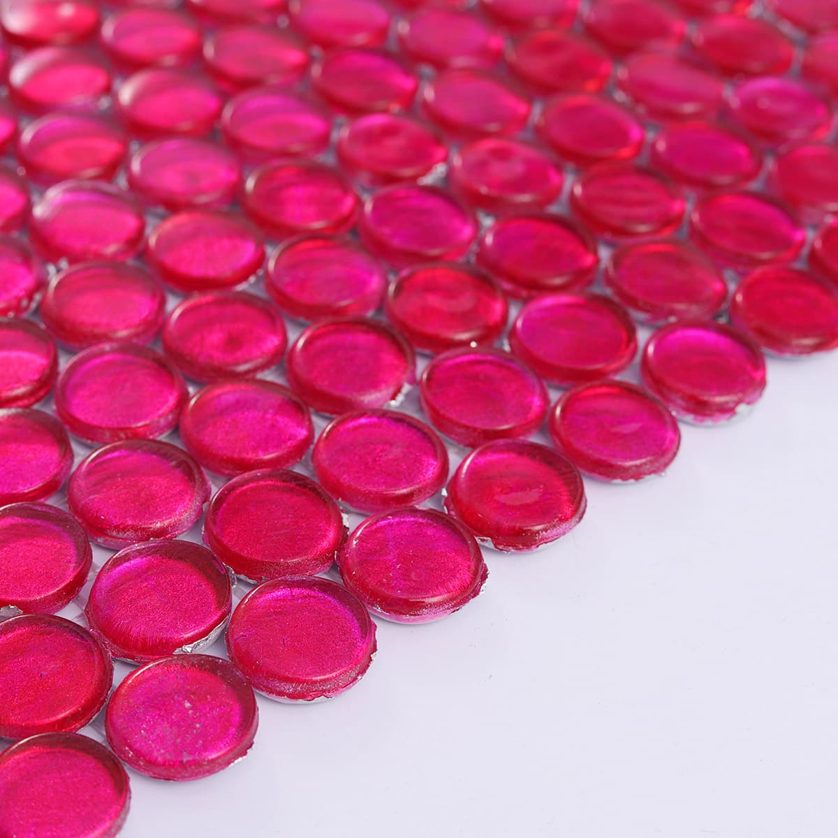 Close texture view of deep pink glossy round glass mosaics