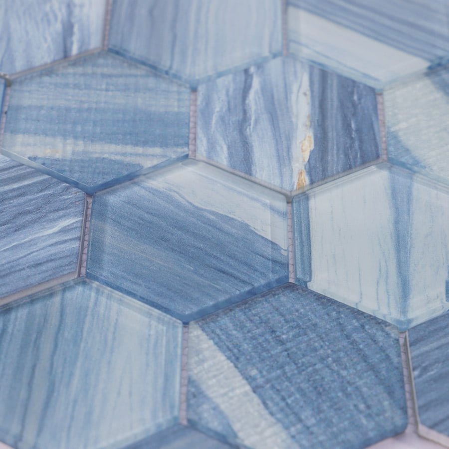 Detailed view of blue hexagon glass mosaic surface with glossy marble finish