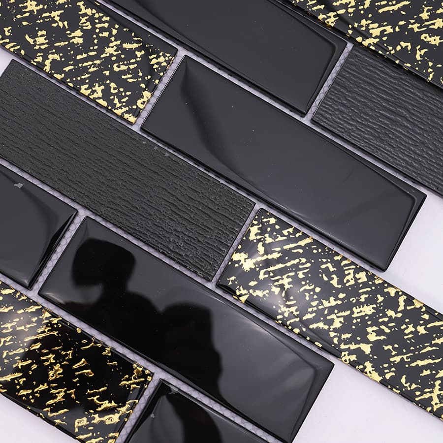Detailed pattern of black and gold rectangular glass mosaic subway tile