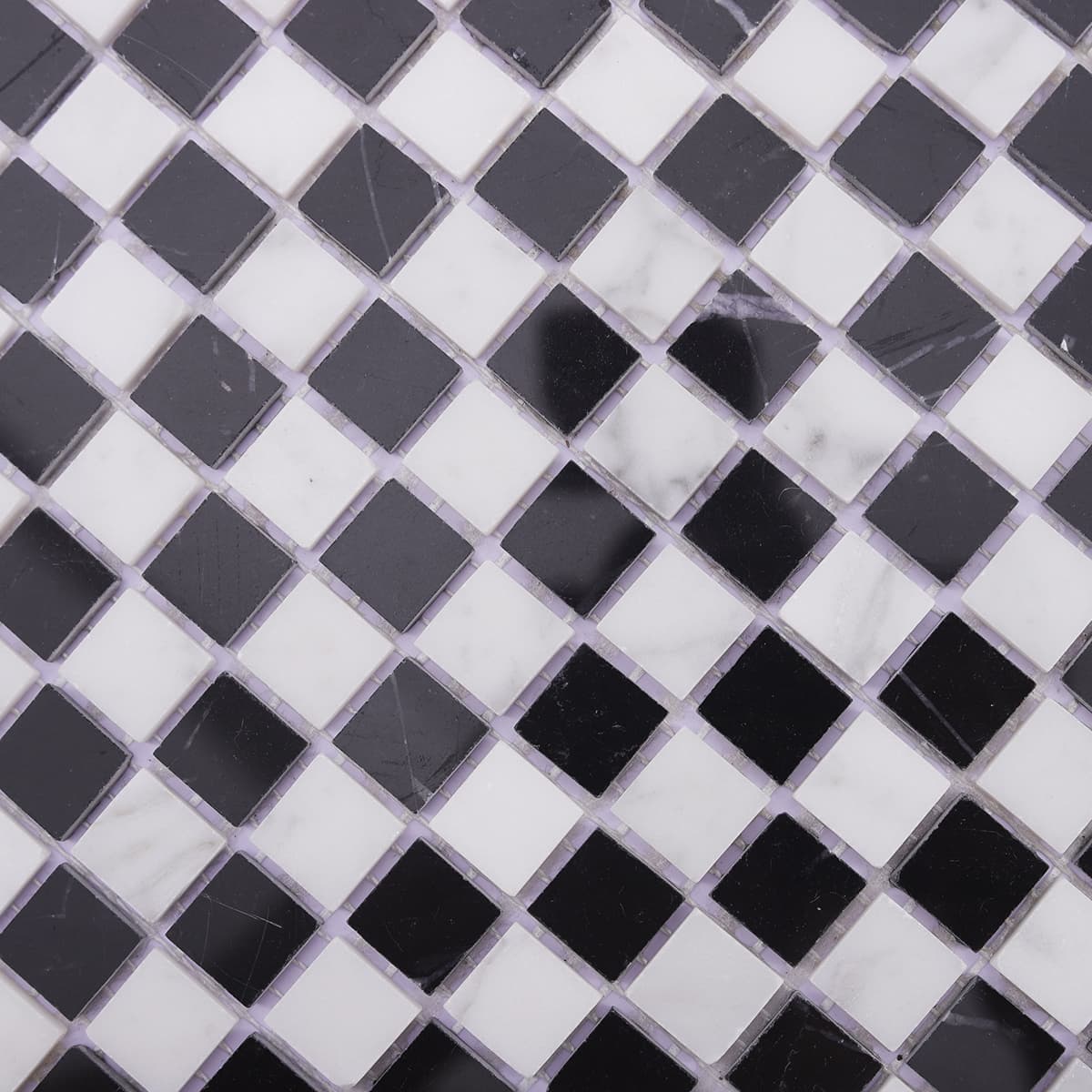 Detailed texture of black and white marble mosaic tile with glossy finish