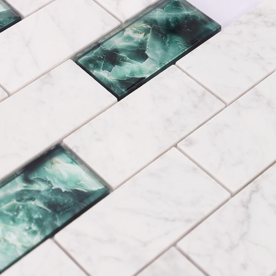 Detailed view of white marble and green glass subway tile with natural marble texture