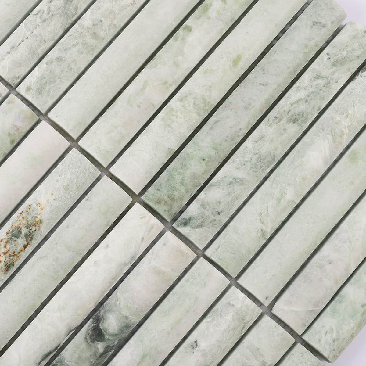 Diagonal view of light green fluted marble mosaic surface