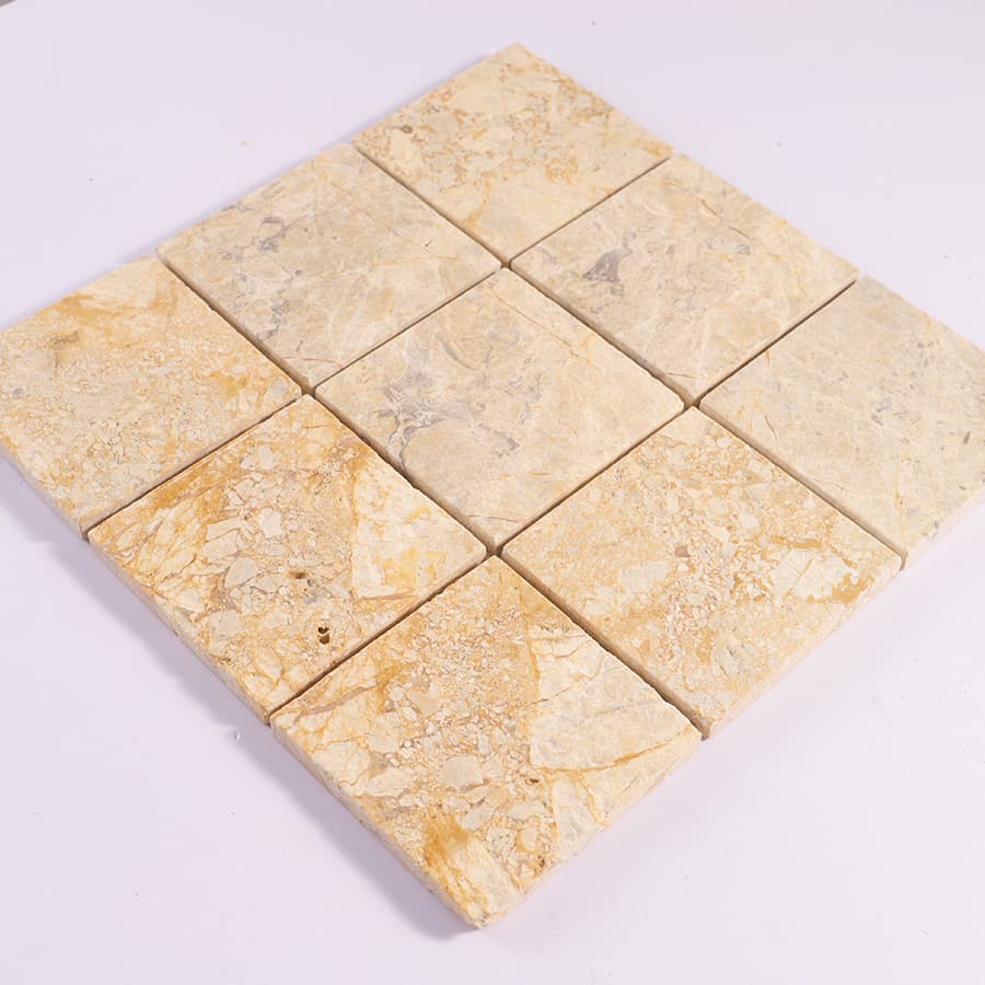 Diagonal view of beige marble square mosaic tile sheet