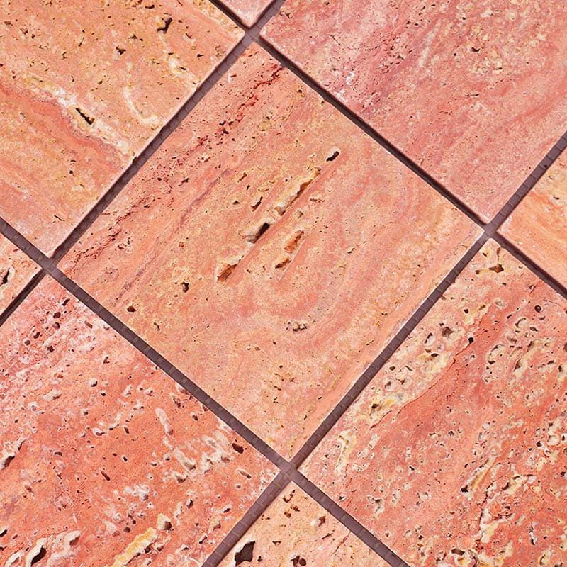 Diagonal angle view of red travertine mosaic tile sheet