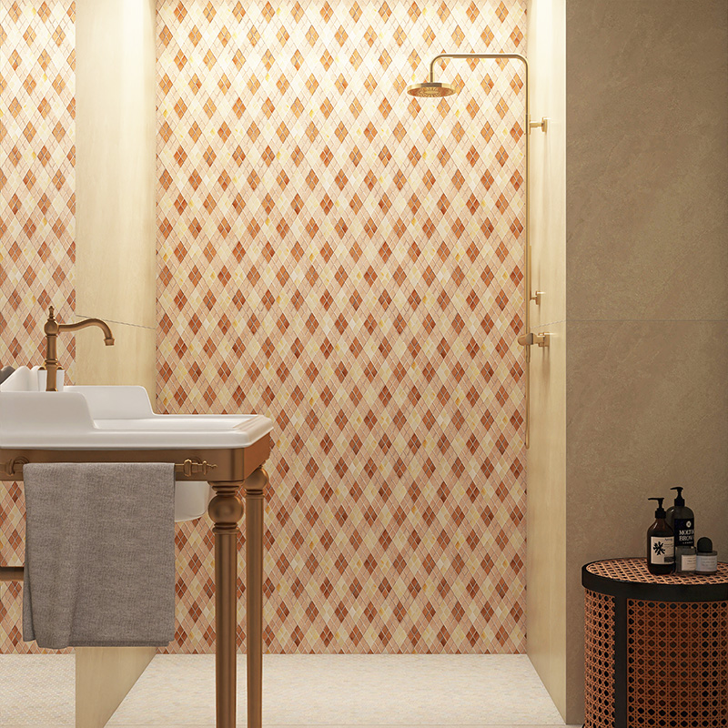 elegant shower wall with beige and red diamond mosaic tiles and golden fixtures