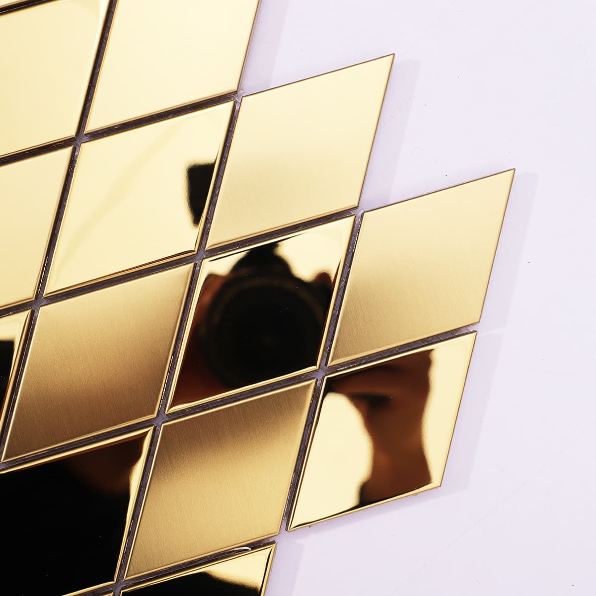 Corner detail of diamond gold stainless mosaic tile