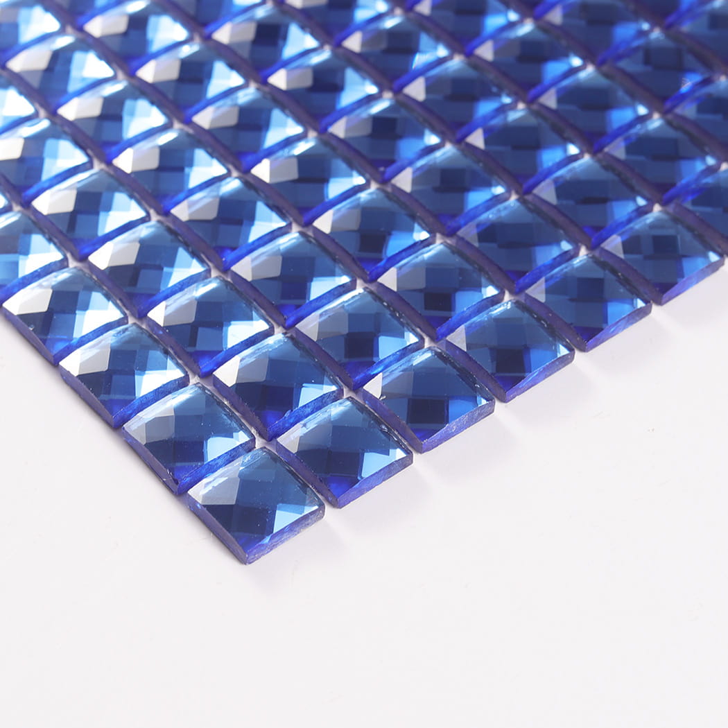 Angled edge view highlighting the thickness of blue square mirror glass mosaic chips.