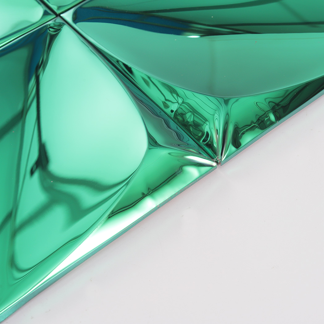 Angled edge view showing the 3D profile of the green reflective tiles.