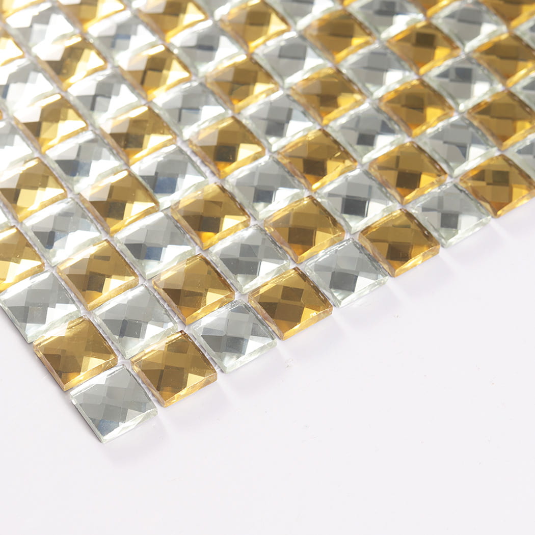Angled edge view highlighting the thickness of gold and silver glass mosaic chips.