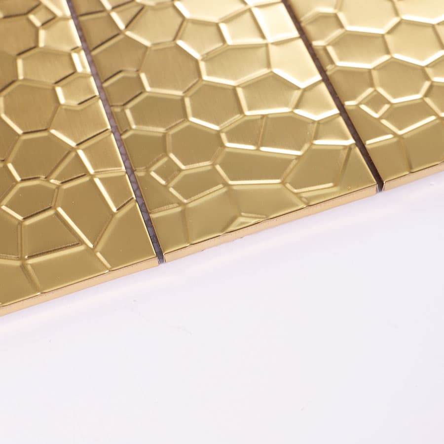 Edge view of gold rectangular stainless steel mosaic with texture