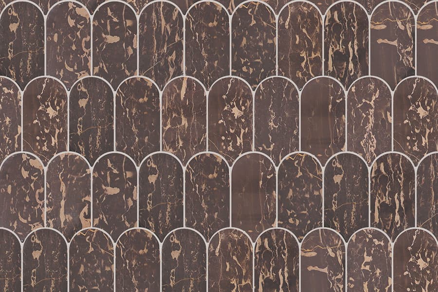 Close-up of elongated fish scale tiles in dark marble pattern