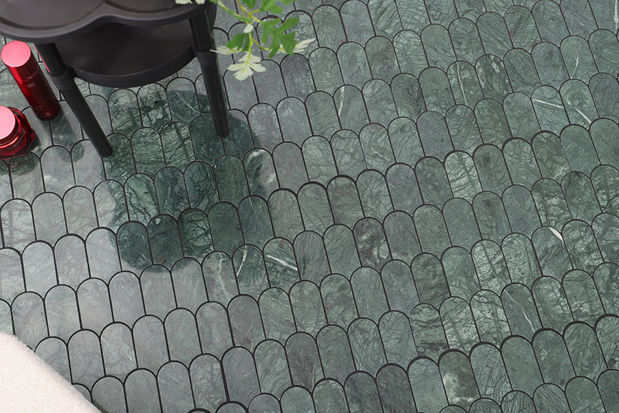 Luxury emerald green natural marble tiles in a picket pattern for home interior.