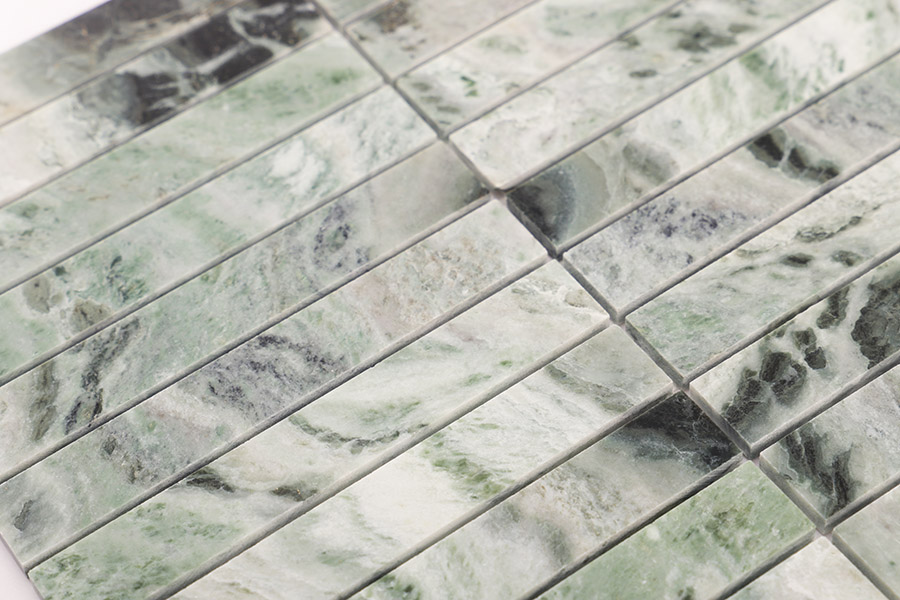 Textured emerald green marble rectangle tiles for luxury kitchen backsplash and bathroom.