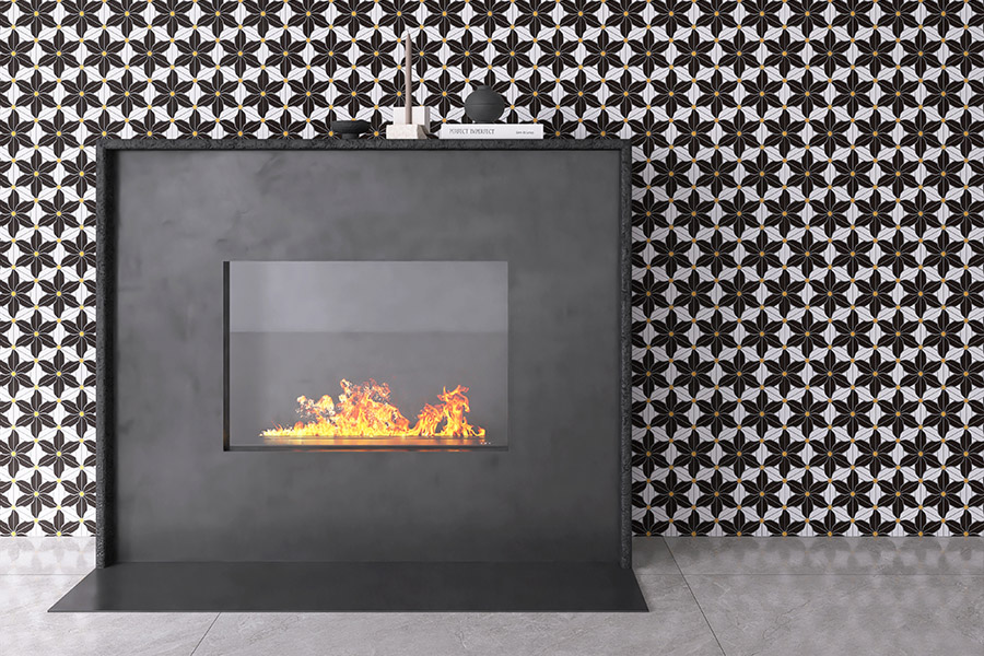 Contemporary fireplace framed by black patterned fireplace tiles on feature wall