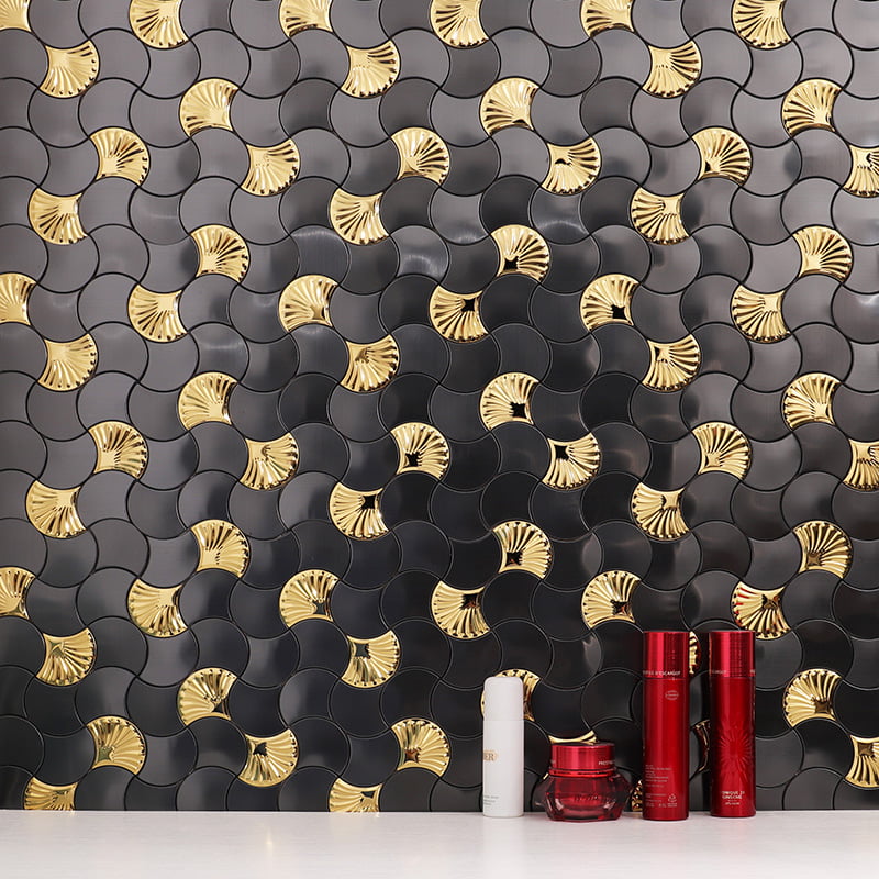 Black and gold fish scale tile backsplash with red bottles