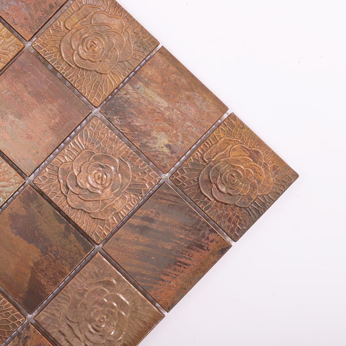 Detail of embossed copper mosaic tile corner
