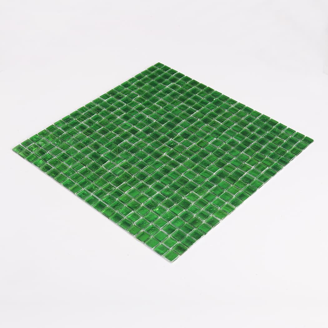 full sheet of forest green glass mosaic tiles photographed at low angle