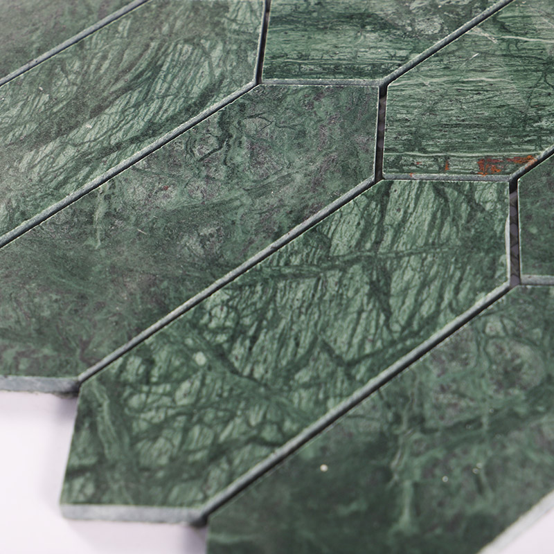 Close-up of forest green marble picket tiles showcasing polished natural stone texture.