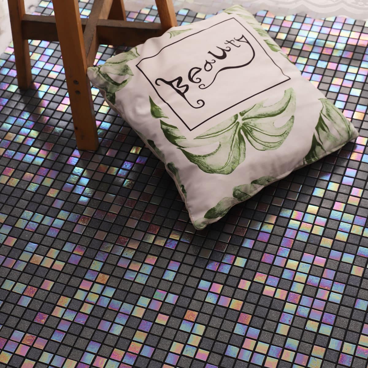 Side angle of glass mosaic floor and pillow