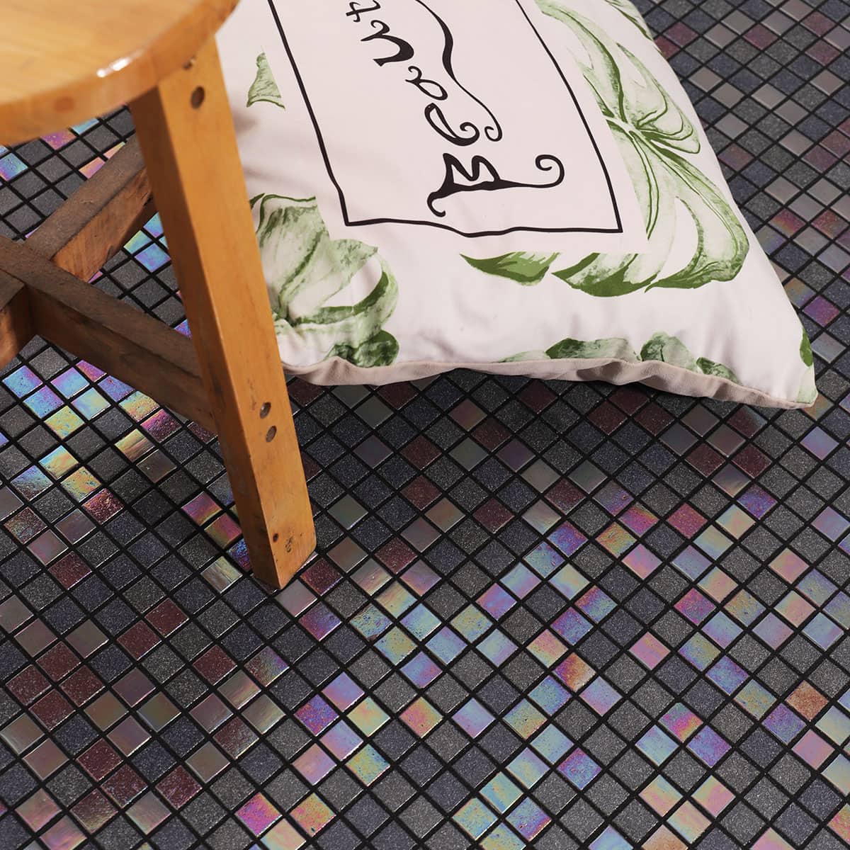 Glass mosaic floor tile with cushion and wooden stool