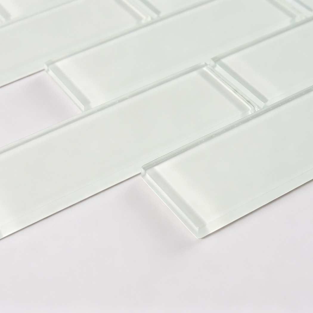 Glossy white glass subway tile with soft marble veins and raised beveled edge