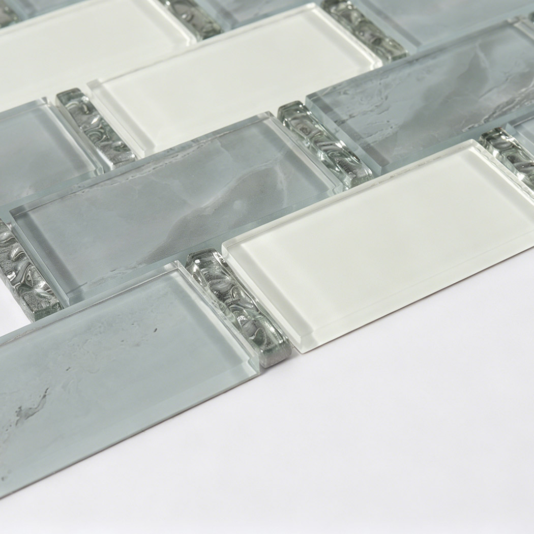 Close view of gray white glass subway mosaic with glossy beveled edges